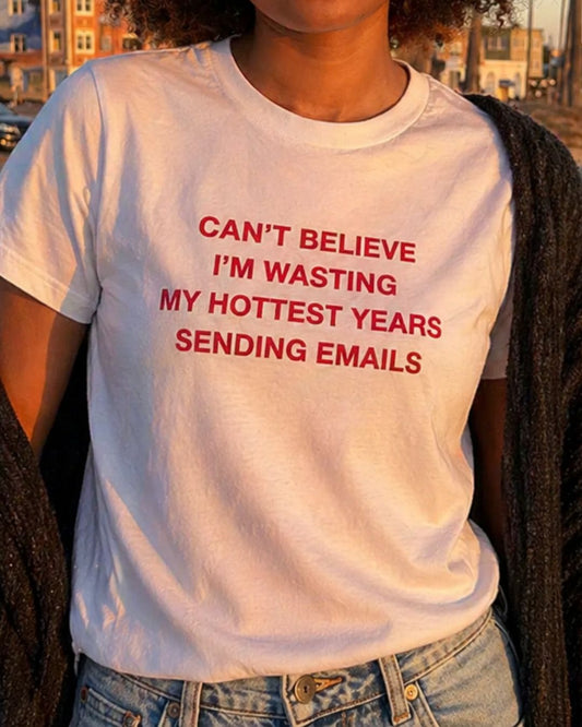 Can’t Believe I’m Wasting My Hottest Years Sending Emails organic graphic T-shirt with funny work culture quote printed on front in minimalist design