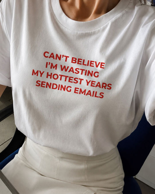 Can’t Believe I’m Wasting My Hottest Years Sending Emails organic graphic T-shirt with funny work culture quote printed on front in minimalist design