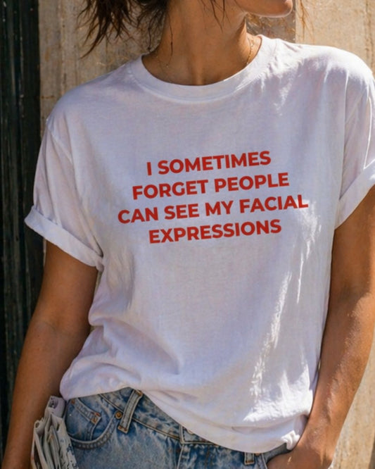 I Sometimes Forget People Can See My Facial Expressions organic graphic T-shirt with funny relatable quote printed on front in minimalist design